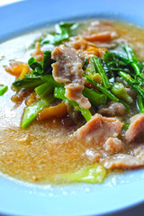 Crispy noodles topped with pork