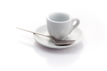 empty espresso cup with a spoon isolated on a white background