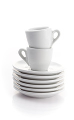 two espresso cups and saucers isolated on a white background