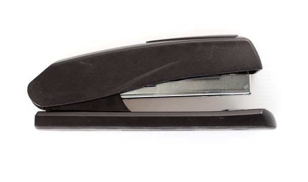 profile of black stapler isolated on a white background