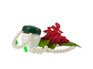 Cosmetic cream pearls and rose.