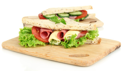Tasty sandwiches with salami sausage and vegetables