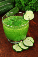 Green vegetable juice on table close-up