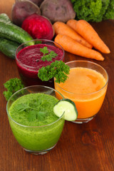 Fresh vegetable juices on table close-up