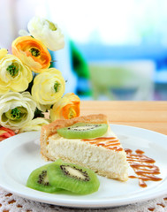 Slice of cheesecake with kiwi fruit