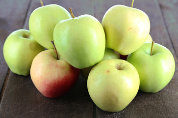 Juicy apples on wooden table