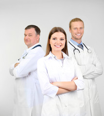 Medical workers on grey background