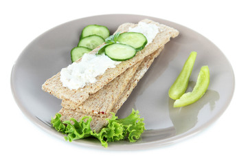Tasty crispbreads with vegetables, isolated on white