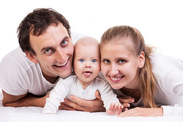 Closeup of young family with baby boy against white