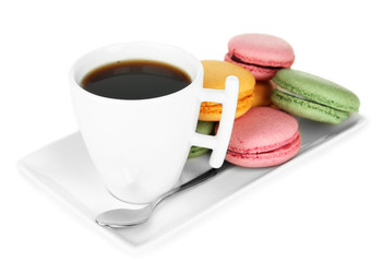 Coffee and macaroons isolated on white