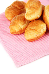 Tasty croissants on napkin close-up