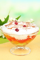 Tasty jelly in bowl on table on light background
