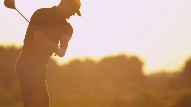 Male Caucasian Golfer Practicing Swing Silhouette