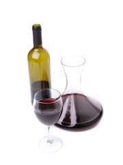 Decanter, bottle and glass with red wine.