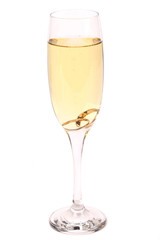 Glass of champagne with wedding rings
