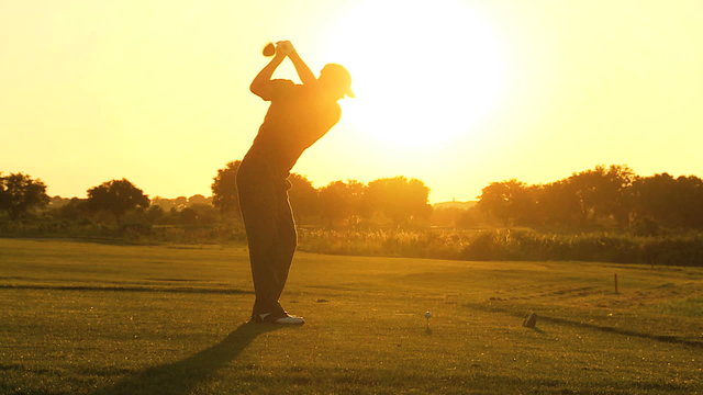 Male Caucasian Golfer Practicing Swing Silhouette