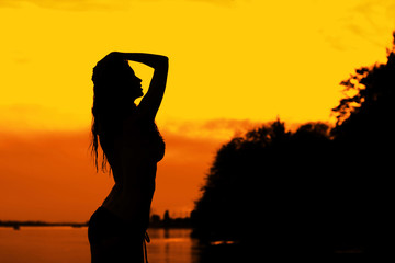 Woman in sunset