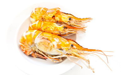 Grilled prawns on white plate isolated