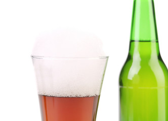 Closeup of bottle and glass with beer.