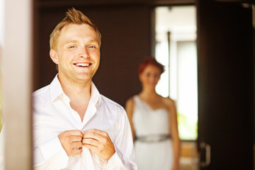Fototapeta premium couple preparing at home for a wedding