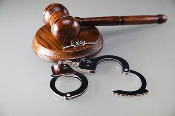 Law gavel and handcuffs, A pair of handcuffs and gavel