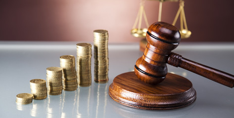 Scales of justice and gavel, gold coins