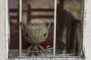 Halloween toy devil in a wnidow