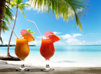 Two fresh juices on beach