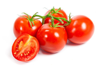 Closeup of tomatoes on the vine isolated on white. Tomato branch