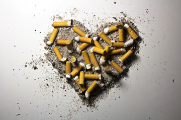 Heart made of smoked cigarettes and ash