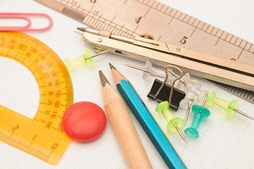 office tools on graph paper