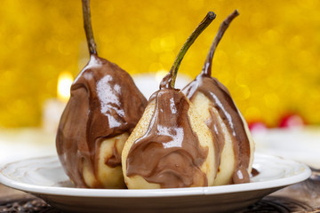 Pear in chocolate, yellow background