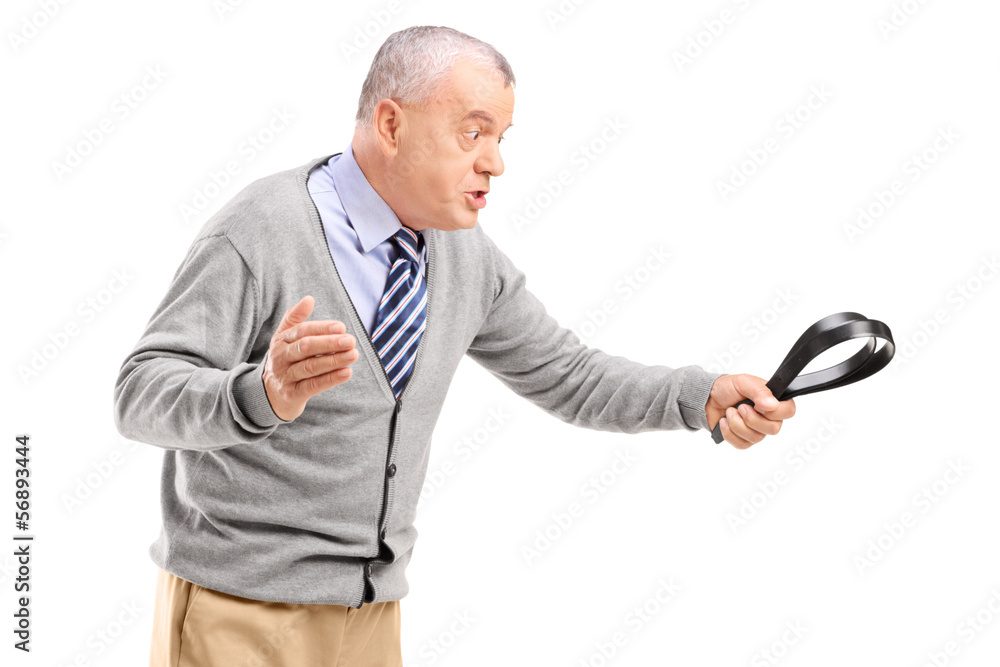 Poster Angry mature man holding a belt and threatening