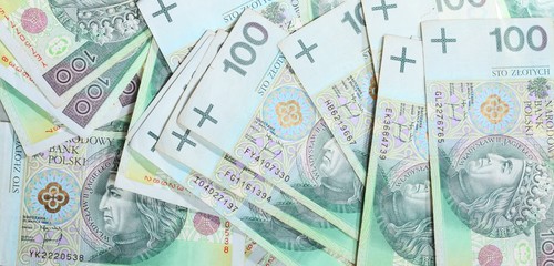 Naklejka premium 100's polish zloty banknotes as money background