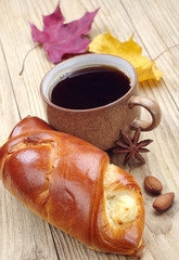 Bun and cup of coffee