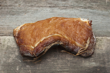 pieces smoked fish on a old wooden table