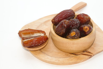 Ripped dates in the wooden plate
