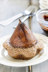 Pear in cake with chocolate sauce