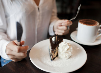 woman eating a piece of cake
