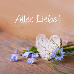 Herz und Blüten auf Holz - Glückwunschkarte