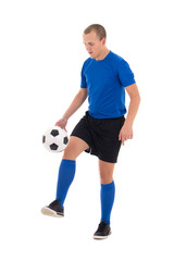 soccer player in blue uniform playing with ball on white backgro