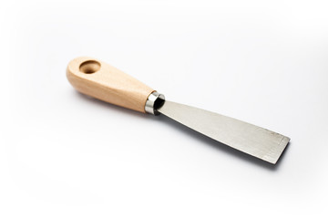 Putty knife on light background