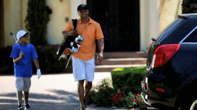 Ethnic Father Young Son Preparing Play Golf