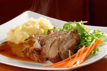 Fried pork chop, mashed potato and vegetable salad