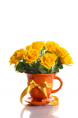 yellow roses in a pot