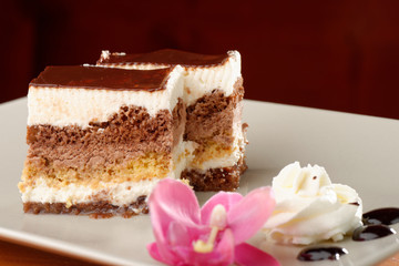 chocolate cream cake on white plate