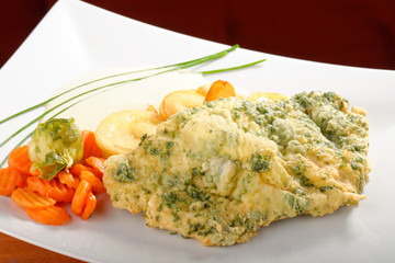 Pork chop with spices, potatoes and vegetables