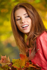 Naklejka premium Young woman in beautiful autumn park, concept autumn