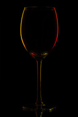 Colored glass silhouette over black background