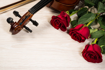 Fototapeta premium Violin, rose and music books